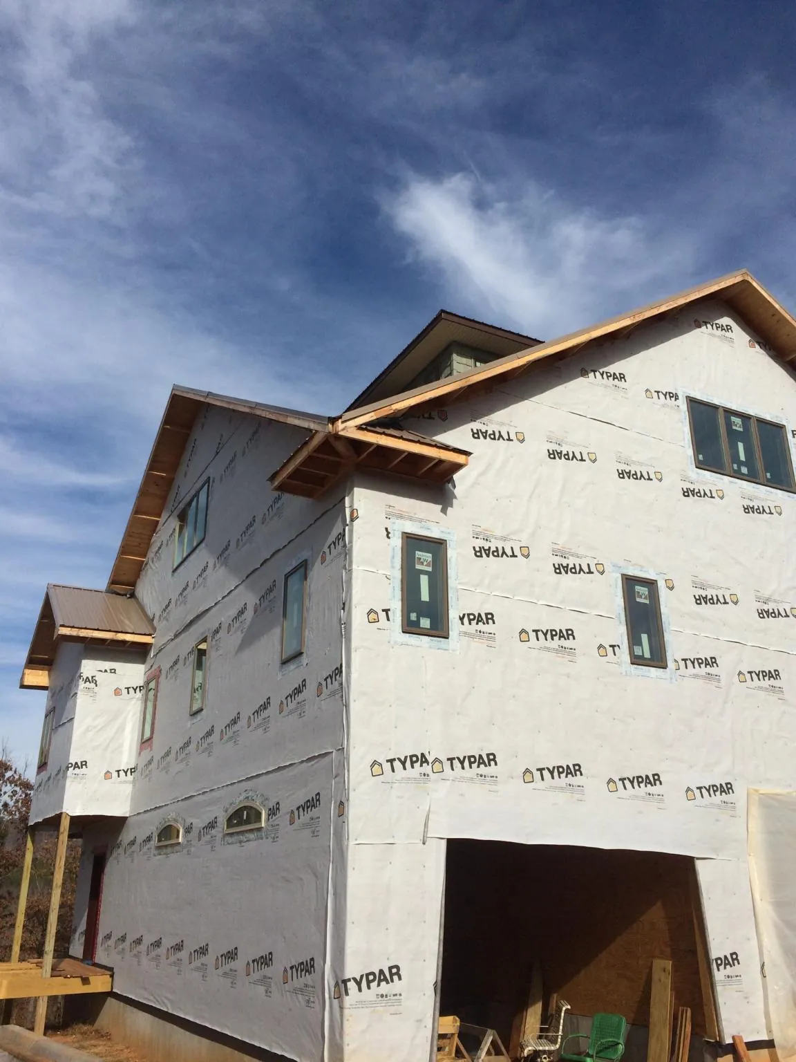 Stick built house wrapped in Typar with new roof framing and dormers in Imnaha